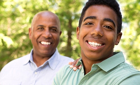 Father and son smiling