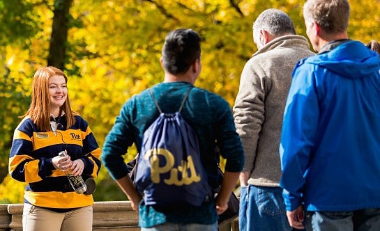 Pitt Pathfinder student tour guide giving a tour of campus