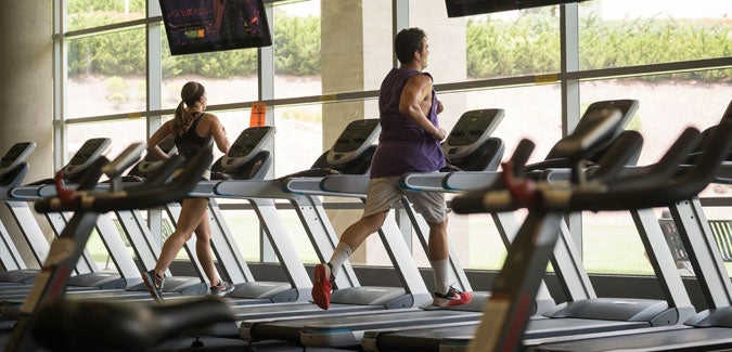 Students running on treadmill.