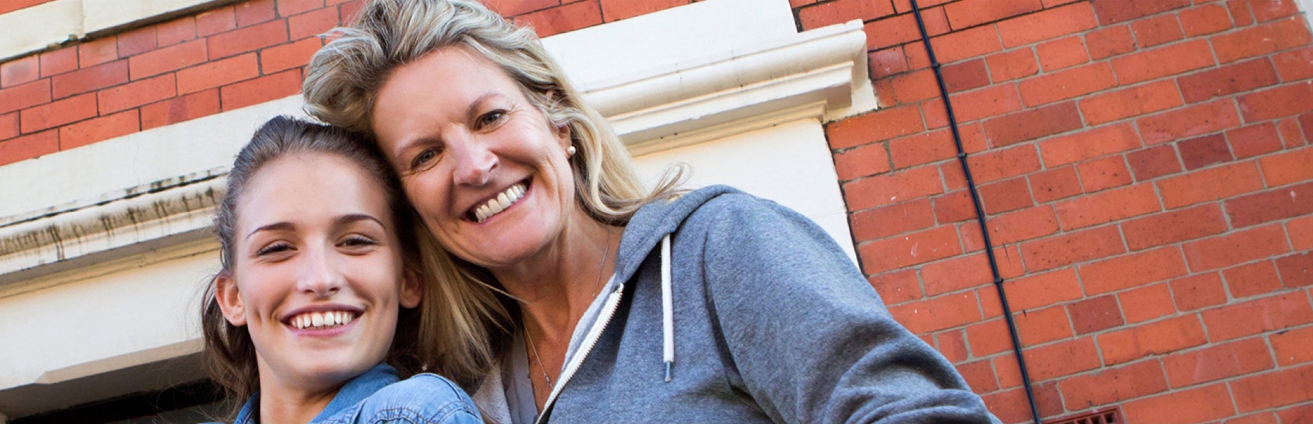 mother and daughter smiling