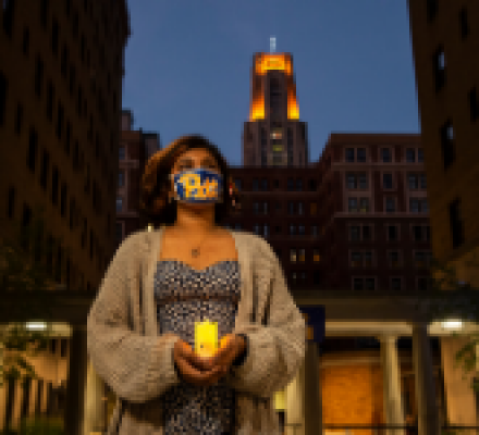 First-year student holding a candle for the Lantern Night Ceremony.