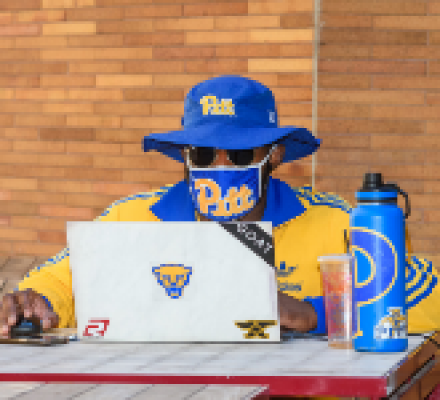 Pitt student using a laptop