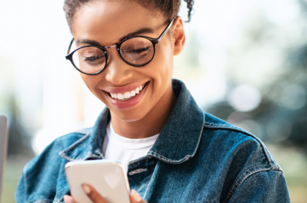 Woman smiling at smart phone