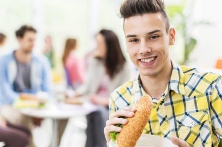 Student eating in cafeteria
